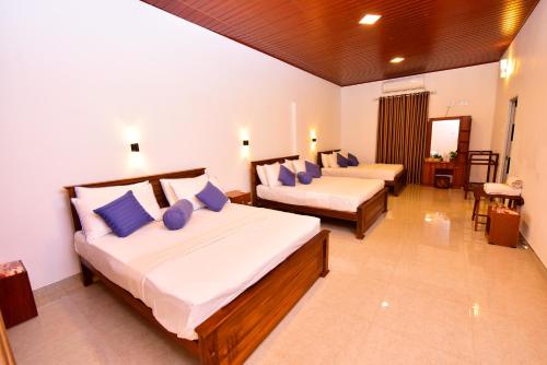 Cama o camas de una habitación en Ariya Rest & Ayurveda spa