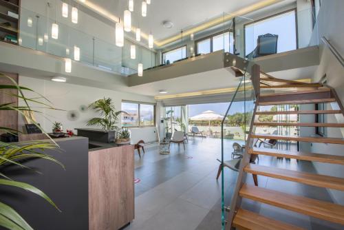 a staircase in a house with a living room at Incognito Creta Luxury Suites and More in Kolymvari