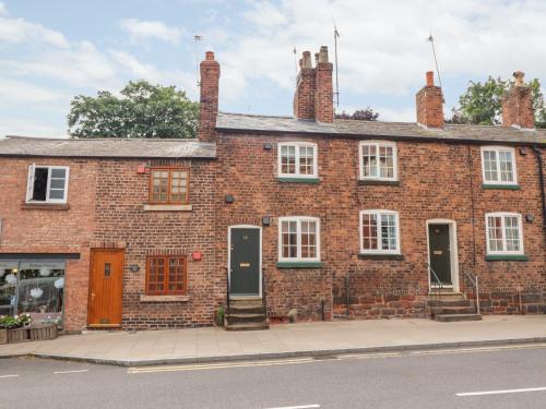 a brick building on the side of a street at Tower View Cottage in Chester