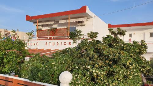 a building with a sign that reads active studios at Irene Studios in Kefalos