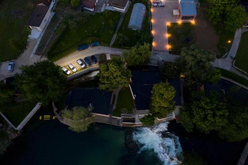 an overhead view of a bridge over a river at night at Apartment Vila Tara in Bihać