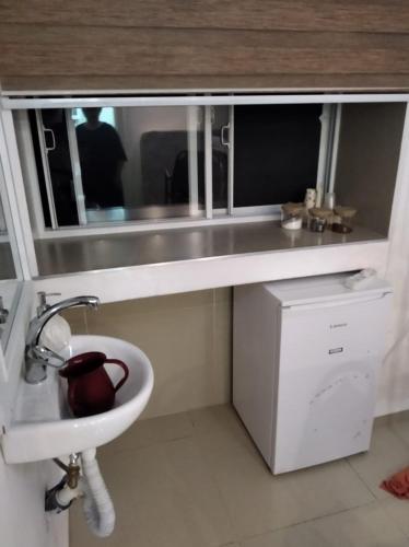 a bathroom with a white sink and a mirror at הפנינה של צפת in Safed