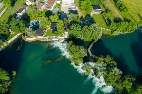 an aerial view of a house next to a river at Apartment Vila Tara in Bihać