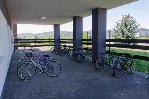 a group of bikes parked under a building at Ubytovňa Milex in Nové Mesto nad Váhom