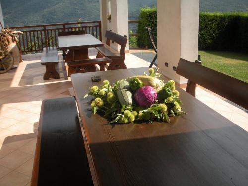 a bunch of vegetables sitting on a table on a table at Agritur Maso Pomarolli in Giovo