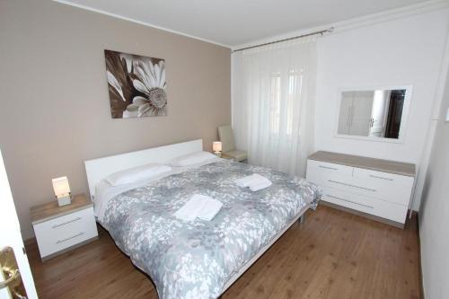 Ένα ή περισσότερα κρεβάτια σε δωμάτιο στο Ondina
