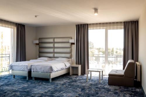 Кровать или кровати в номере Ferry Resort