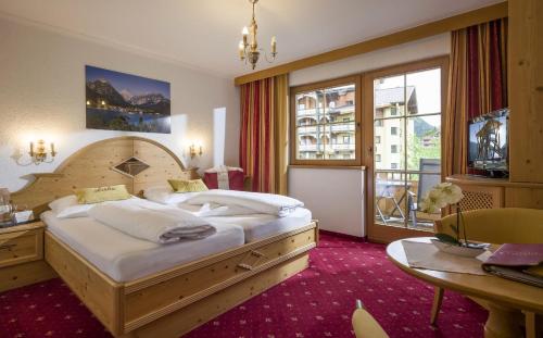Кровать или кровати в номере Liebes Caroline 4-Sterne-Hotel