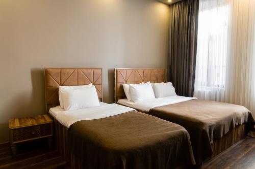 A bed or beds in a room at Taksim Mood