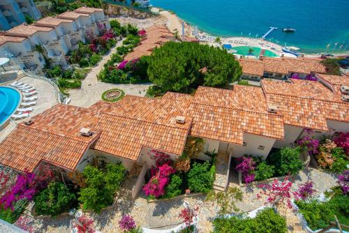 an aerial view of a resort with flowers on the roofs at Bougainville Bay Apartments in Sarandë