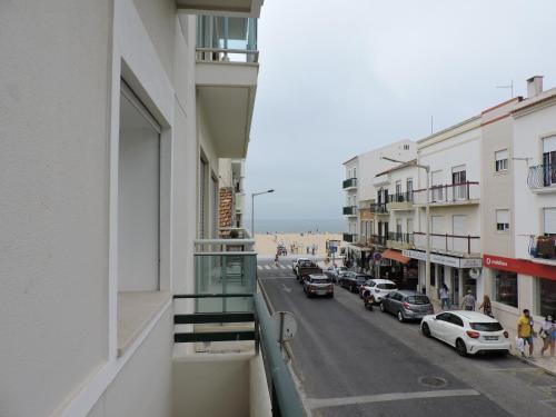 a view of a street from a balcony of a building at Apartamento Atalaia in Nazaré