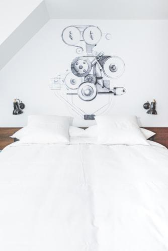 a bedroom with a bed with a drawing on the ceiling at Hotel Bernina Geneva in Geneva