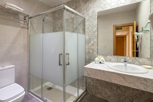 a bathroom with a shower and a sink at Catalunya in Barcelona