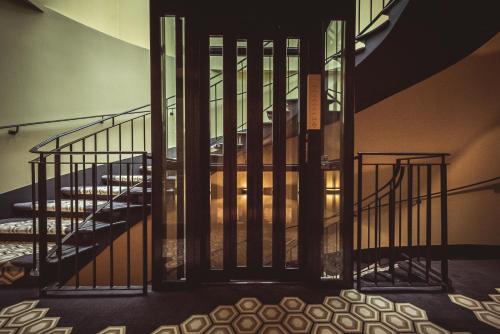 a staircase in a building with a stair case at Hotel Bernina Geneva in Geneva