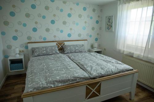 Postel nebo postele na pokoji v ubytování Kleine Reetstube