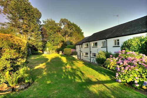 an image of a house with a yard at The East Wing @ Lower Broom Farm in Kilgetty