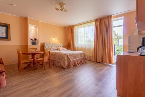 Postel nebo postele na pokoji v ubytování Fortuna Apartments