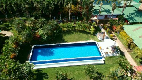 an overhead view of a swimming pool in a yard at Hotel Villas Rio Mar in Dominical