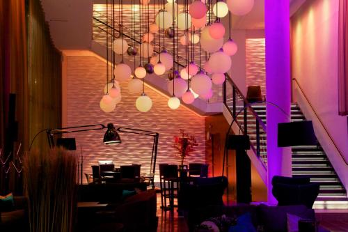 a living room filled with furniture and lights at Clarion Hotel Sense in Luleå