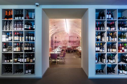 a room filled with lots of bottles of wine at Hotel Lago Di Garda in Nago-Torbole