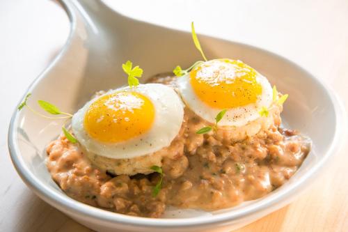 a bowl of food with eggs on top of beans at Hotel Indigo Traverse City by IHG in Traverse City