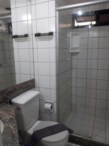 a bathroom with a toilet and a shower at Villa Costeira Beira Mar in Fortaleza