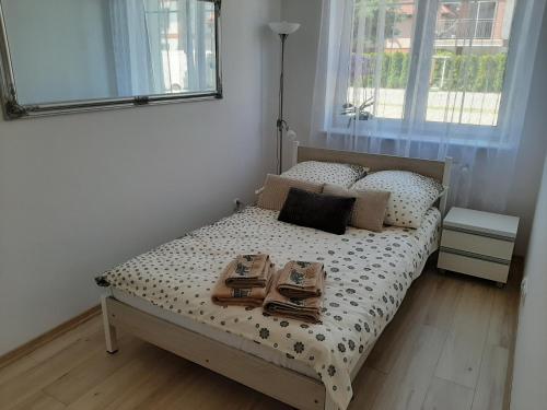 Łóżko lub łóżka w pokoju w obiekcie Apartament nad Jeziorem Olecko
