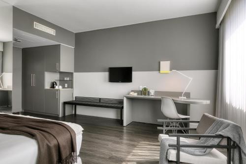 Телевизор и/или развлекательный центр в Caesar Business Belo Horizonte Belvedere