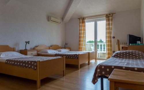 Postel nebo postele na pokoji v ubytování Guesthouse Palombaro