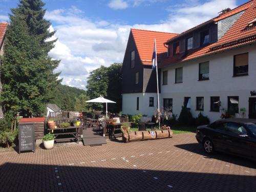 a black car parked in front of a building at fun4all-holidayhome in Medebach