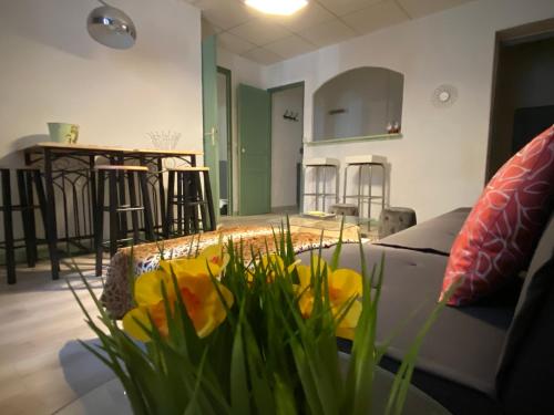 a living room with a couch and a table at La Cigale in Annot