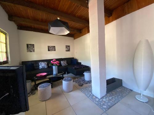 a living room with a couch and a table at La Cigale in Annot