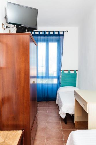 Ένα ή περισσότερα κρεβάτια σε δωμάτιο στο La Mezzanella Guesthouse