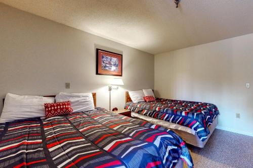 two beds sitting next to each other in a room at Wellington Manor in Wells