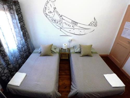 Uma cama ou camas num quarto em Aveiro Guest House