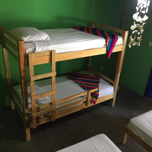a couple of bunk beds in a room at Sunrise El Paredón in El Paredón Buena Vista