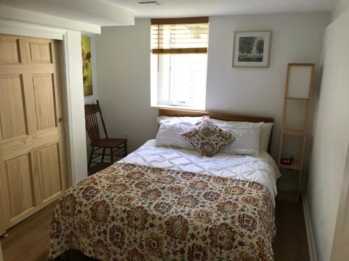 a bedroom with a bed and a window at Newly renovated, large one bedroom guest suite close to Washington DC in a quiet neighborhood in Silver Spring