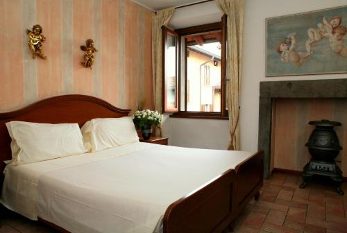 En eller flere senger på et rom på Hotel Ristorante La Bettola