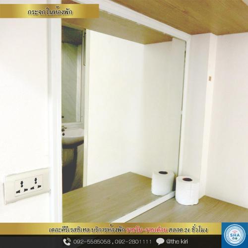 a bathroom with two rolls of toilet paper in a room at The Kiri Resitel in Phetchaburi