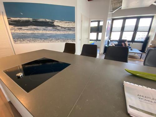 a conference room with a table and chairs at Luxus-Loft-Sylt in Westerland (Sylt)