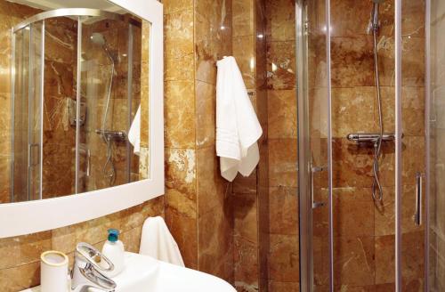 a bathroom with a shower and a sink at estrada15 in Avila