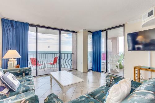 a living room with a couch and a view of the ocean at Palms Resort 1502 in Myrtle Beach