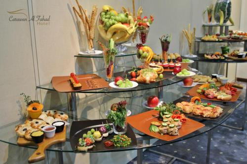 a table with many different types of food on display at Carawan Al Fahad Hotel in Riyadh