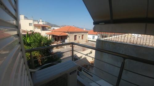 a balcony with a view of a building at Christina Apartment in Derveni