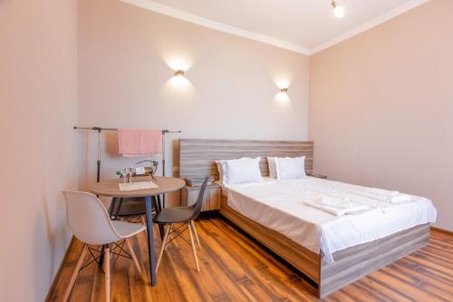 Posteľ alebo postele v izbe v ubytovaní 4 Rooms