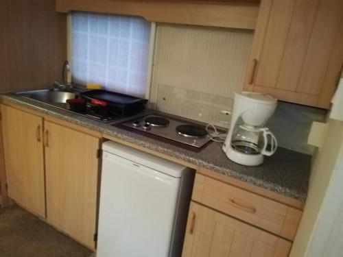 a kitchen with a sink and a counter top at CARAVANAS in Orşova