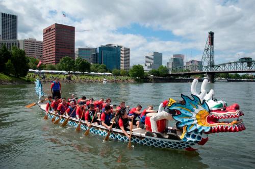 a dragon boat team on the river in a city at Holiday Inn Portland-Airport I-205 by IHG in Portland
