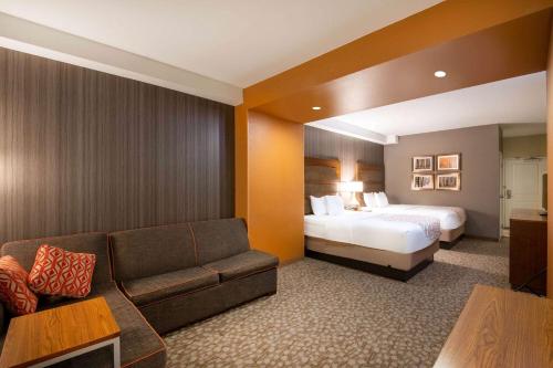 A bed or beds in a room at La Quinta by Wyndham Durango