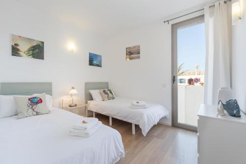A bed or beds in a room at View House with terrace Son Serra Mallorca