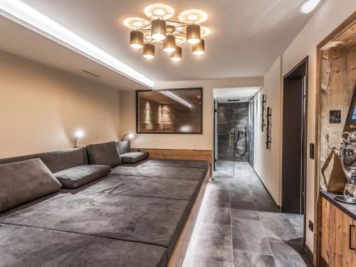 a living room with a couch and a shower at Chalet Montafon-1 by Interhome in Gaschurn